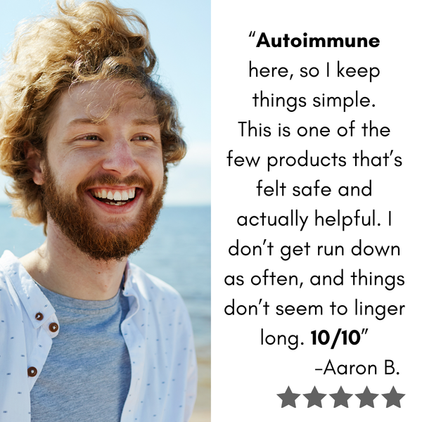 Man with a beard and curly hair smiling outdoors, with text about Vitamin C formulated for a person with autoimmune disease..
