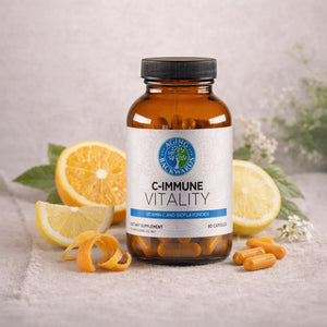 Supplement bottle labeled 'C-Immune Vitality' with lemons and capsules on a neutral background