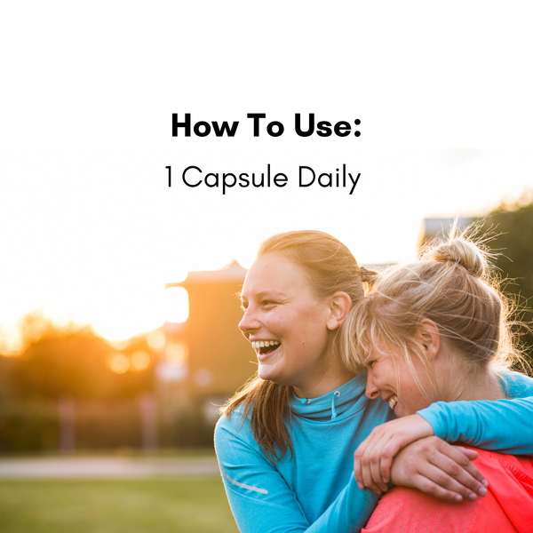 Two people laughing outdoors with text about taking one capsule daily.