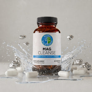 Supplement bottle labeled 'Mag Cleanse' with white capsules on a gray background