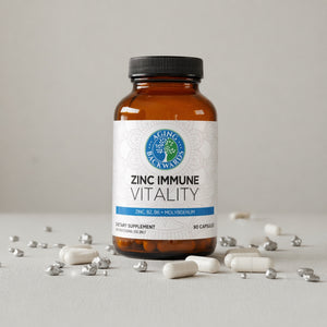 Supplement bottle labeled 'Zinc Immune Vitality' on a light gray background with scattered capsules.
